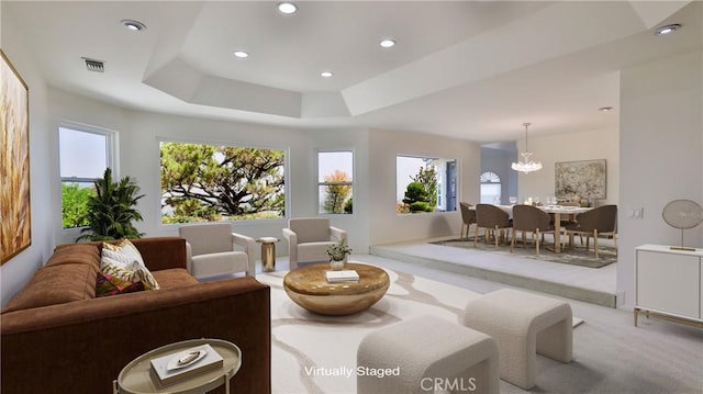 living area with recessed lighting, a raised ceiling, visible vents, an inviting chandelier, and carpet flooring