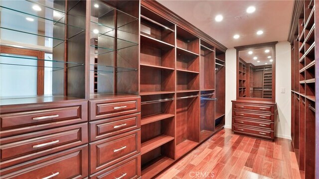 spacious closet featuring light wood-type flooring