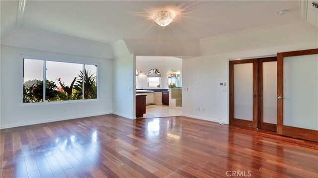 unfurnished living room with hardwood / wood-style flooring