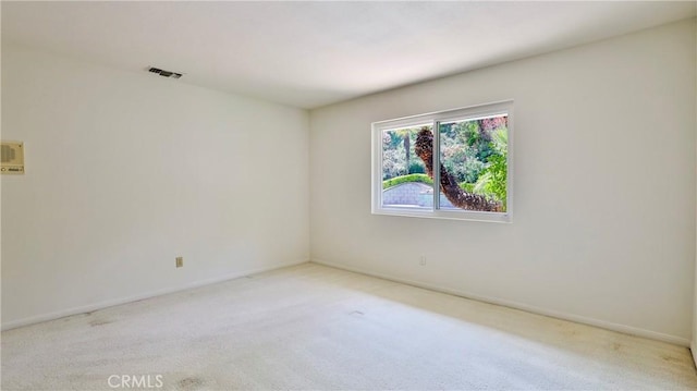 empty room with light colored carpet