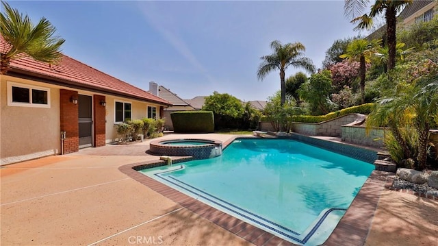 view of swimming pool featuring a pool with connected hot tub, a patio area, and fence