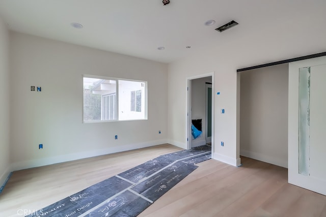 unfurnished bedroom featuring light hardwood / wood-style flooring