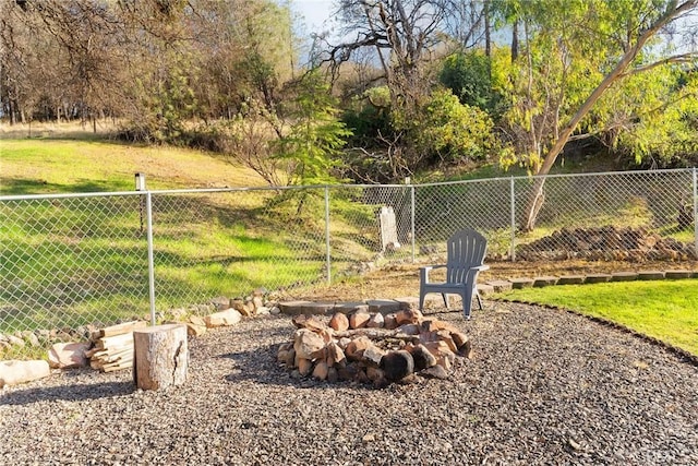 view of yard featuring an outdoor fire pit