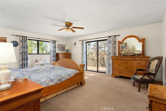 bedroom featuring light carpet, access to outside, and ceiling fan