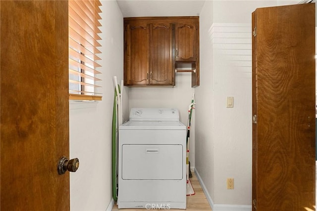 laundry room with washer / clothes dryer and cabinets