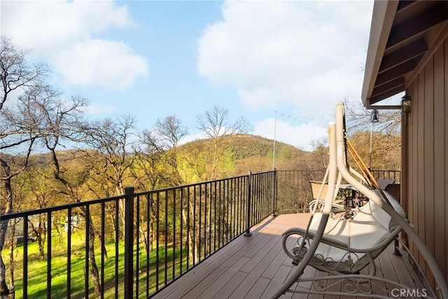 wooden deck featuring a mountain view