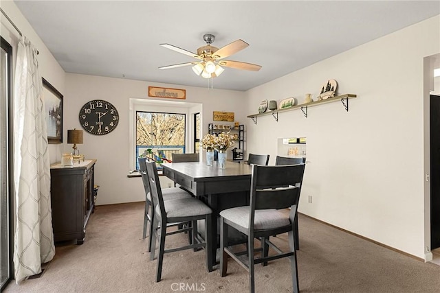 dining room featuring carpet flooring and ceiling fan