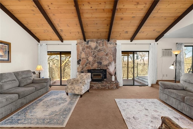 living room featuring light carpet, vaulted ceiling with beams, plenty of natural light, and a wall mounted AC