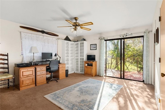 office area with light carpet and ceiling fan