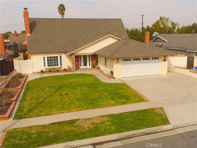 view of front facade featuring a garage and a front yard