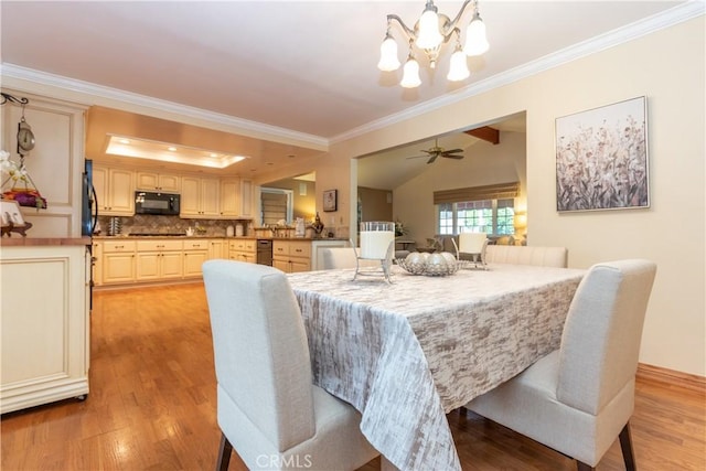 dining area featuring crown molding, vaulted ceiling, ceiling fan with notable chandelier, and light hardwood / wood-style floors