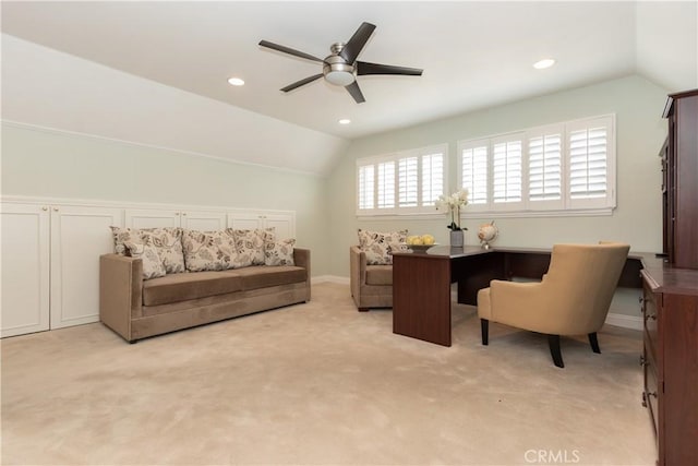 office space featuring ceiling fan, vaulted ceiling, and light carpet