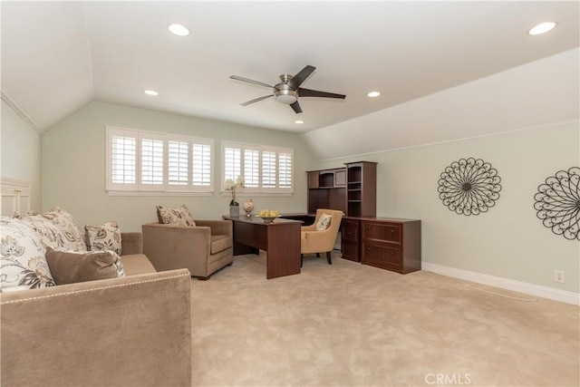 home office featuring vaulted ceiling, light carpet, and ceiling fan