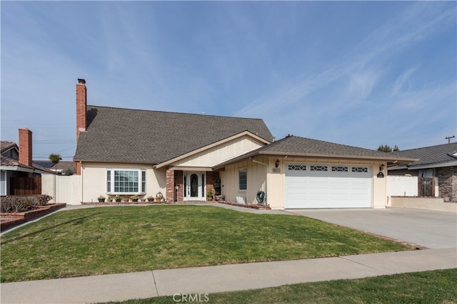 view of front of home with a garage and a front yard