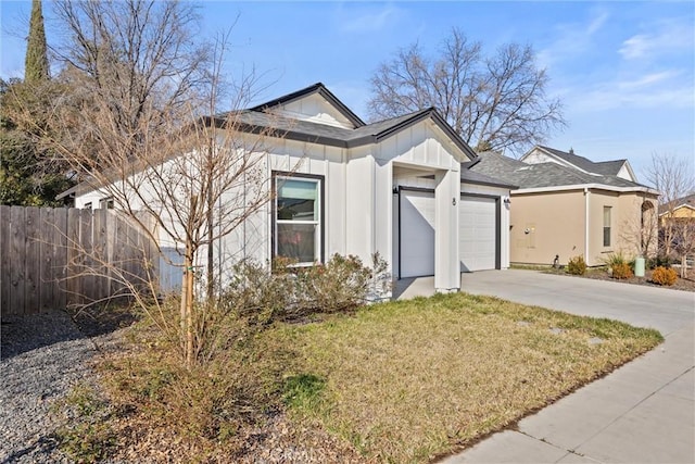 view of front of house with a garage and a front yard