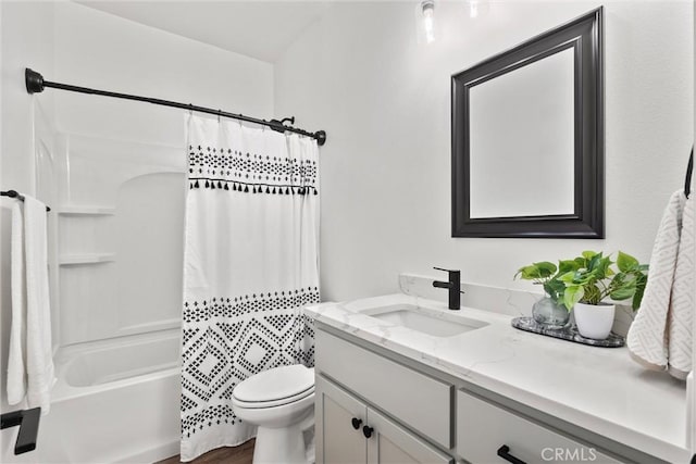 full bathroom with vanity, shower / tub combo with curtain, and toilet