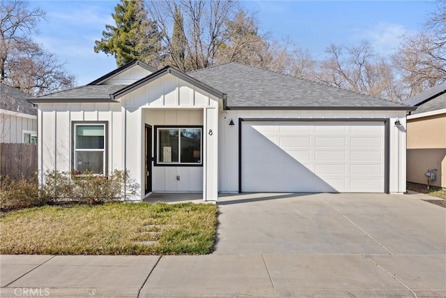 single story home with a garage and a front lawn