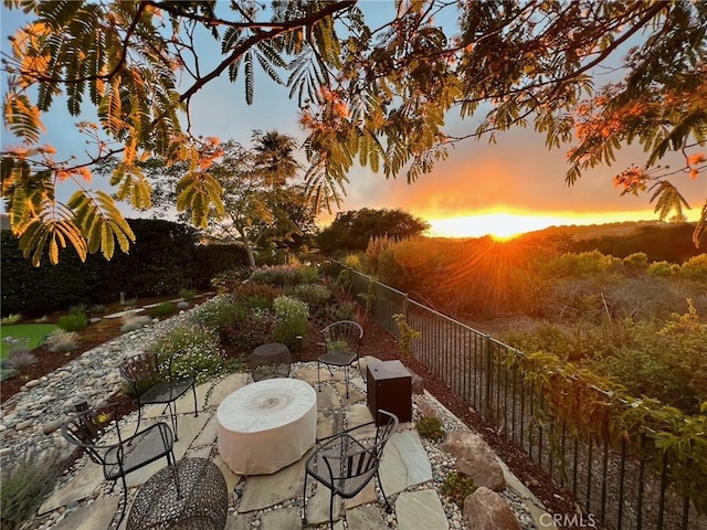 view of patio terrace at dusk