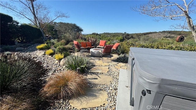 exterior space featuring a patio and a jacuzzi