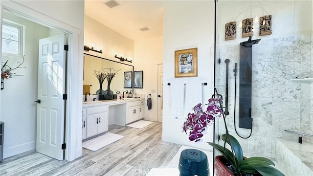 bathroom featuring vanity and wood-type flooring