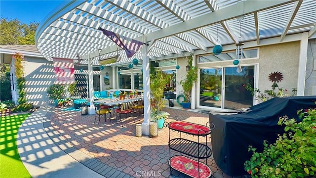 view of patio with a grill and a pergola