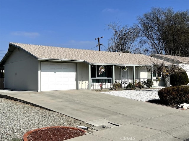 single story home featuring a garage and covered porch