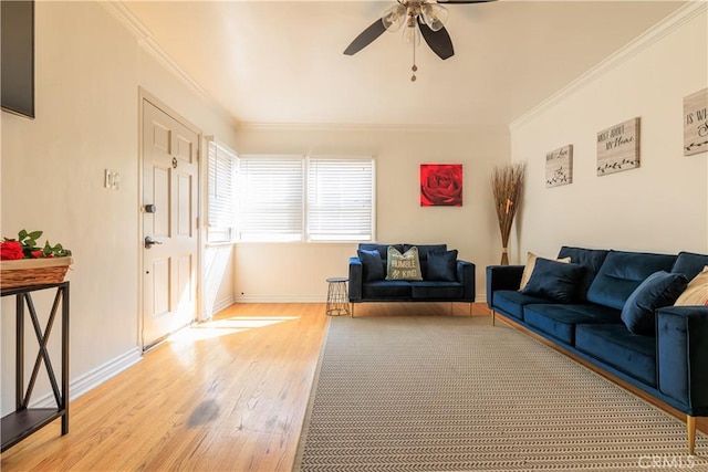 living room featuring ornamental molding, ceiling fan, and light hardwood / wood-style flooring