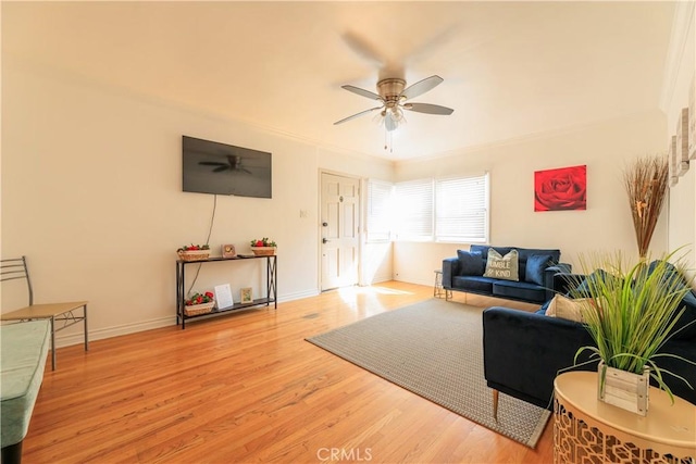 living room with light hardwood / wood-style floors and ceiling fan