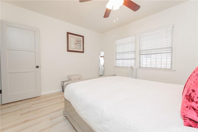 bedroom featuring ceiling fan and light hardwood / wood-style floors