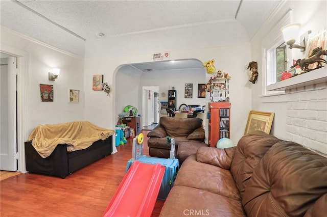 living room featuring hardwood / wood-style floors and a textured ceiling