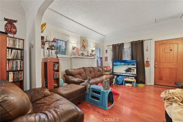 living room featuring hardwood / wood-style floors and a textured ceiling