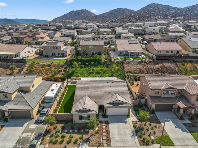 birds eye view of property with a mountain view