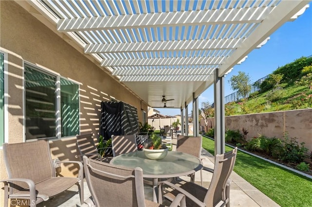 view of patio / terrace featuring ceiling fan and a pergola