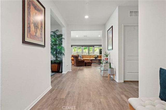 hallway featuring light hardwood / wood-style flooring