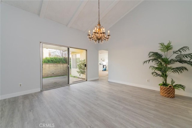 spare room featuring beamed ceiling, high vaulted ceiling, a chandelier, and light hardwood / wood-style floors