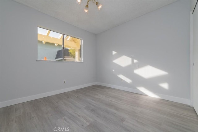 empty room with light hardwood / wood-style floors