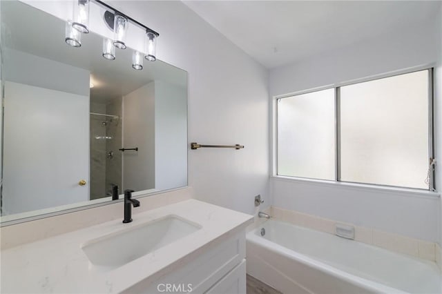 bathroom featuring vanity and plus walk in shower