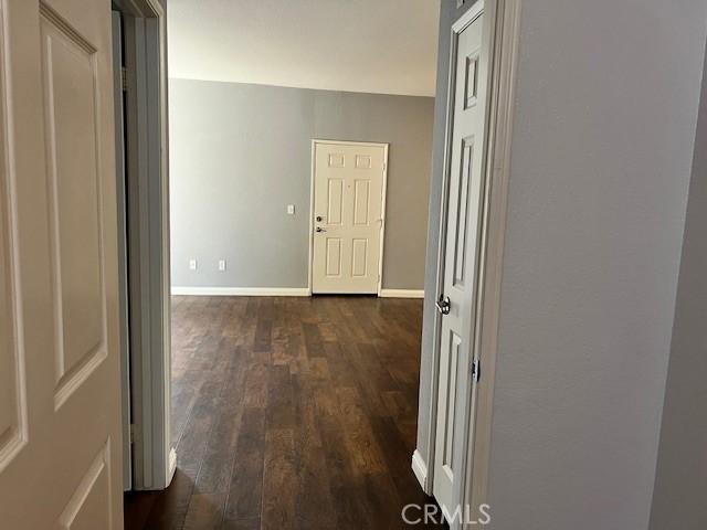 hallway featuring dark wood-type flooring