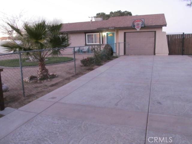 ranch-style house featuring a garage