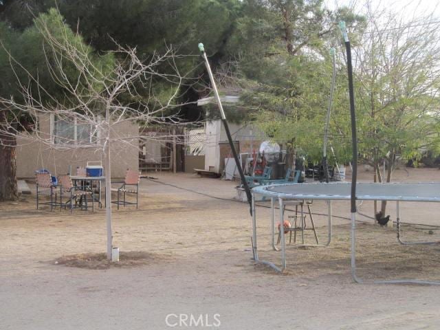 view of yard featuring a trampoline