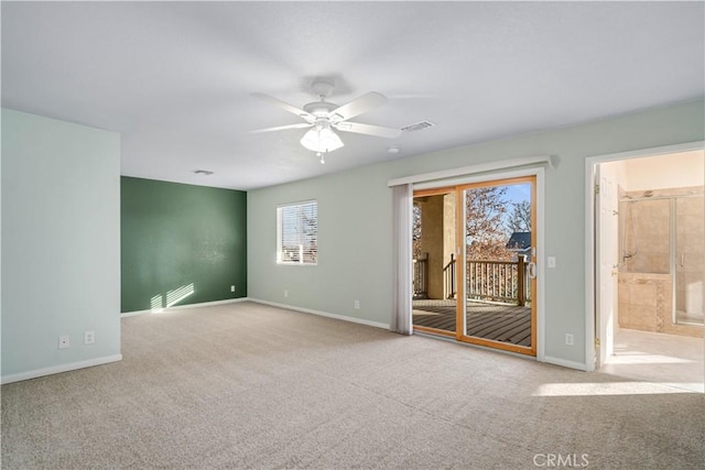 carpeted empty room featuring ceiling fan