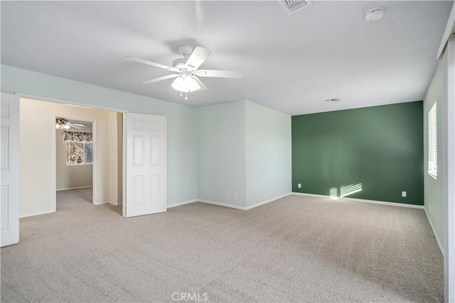 carpeted empty room with ceiling fan