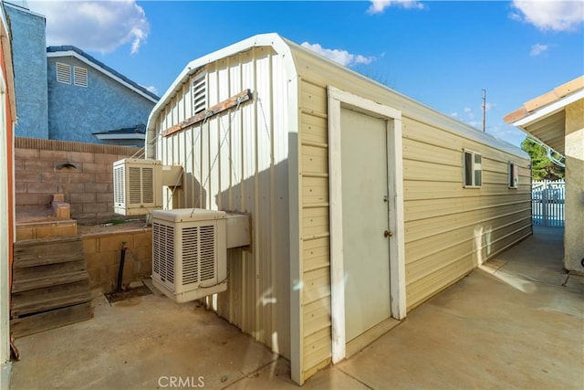 view of outbuilding featuring cooling unit