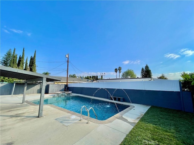 view of pool featuring pool water feature and a patio area