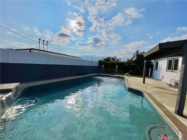 view of swimming pool featuring a patio area