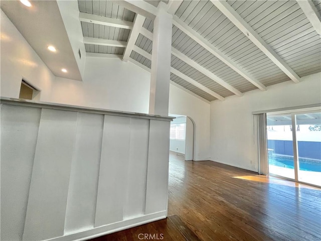 interior space featuring beamed ceiling, high vaulted ceiling, dark hardwood / wood-style floors, and a healthy amount of sunlight