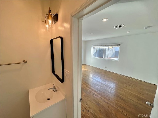 bathroom featuring vanity and hardwood / wood-style floors