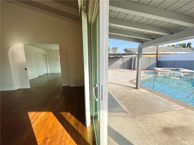 view of pool featuring an in ground hot tub and a patio