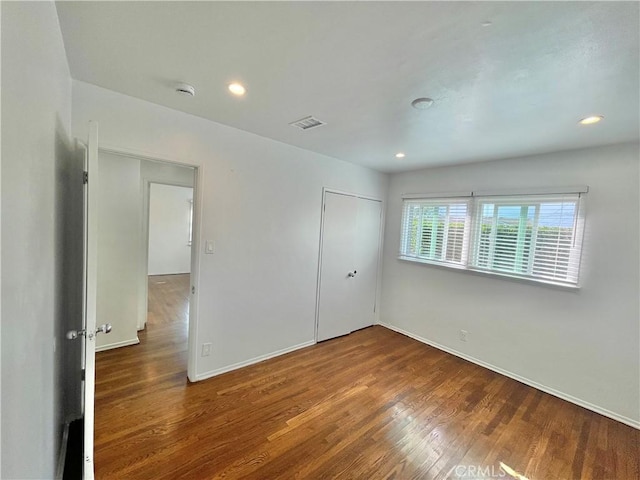 empty room featuring wood-type flooring