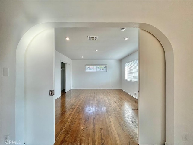 unfurnished room featuring hardwood / wood-style flooring